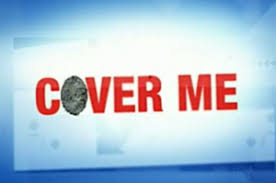 Sign reading 'COVER ME' in bold red letters, with the O replaced by a gray rock.
