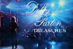 Promotional stage backdrop reading 'Dolly Parton Treasures' with a silhouette on a blue-lit concert stage.